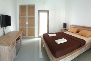King Sized Bed in Private Bungalow with Air Con