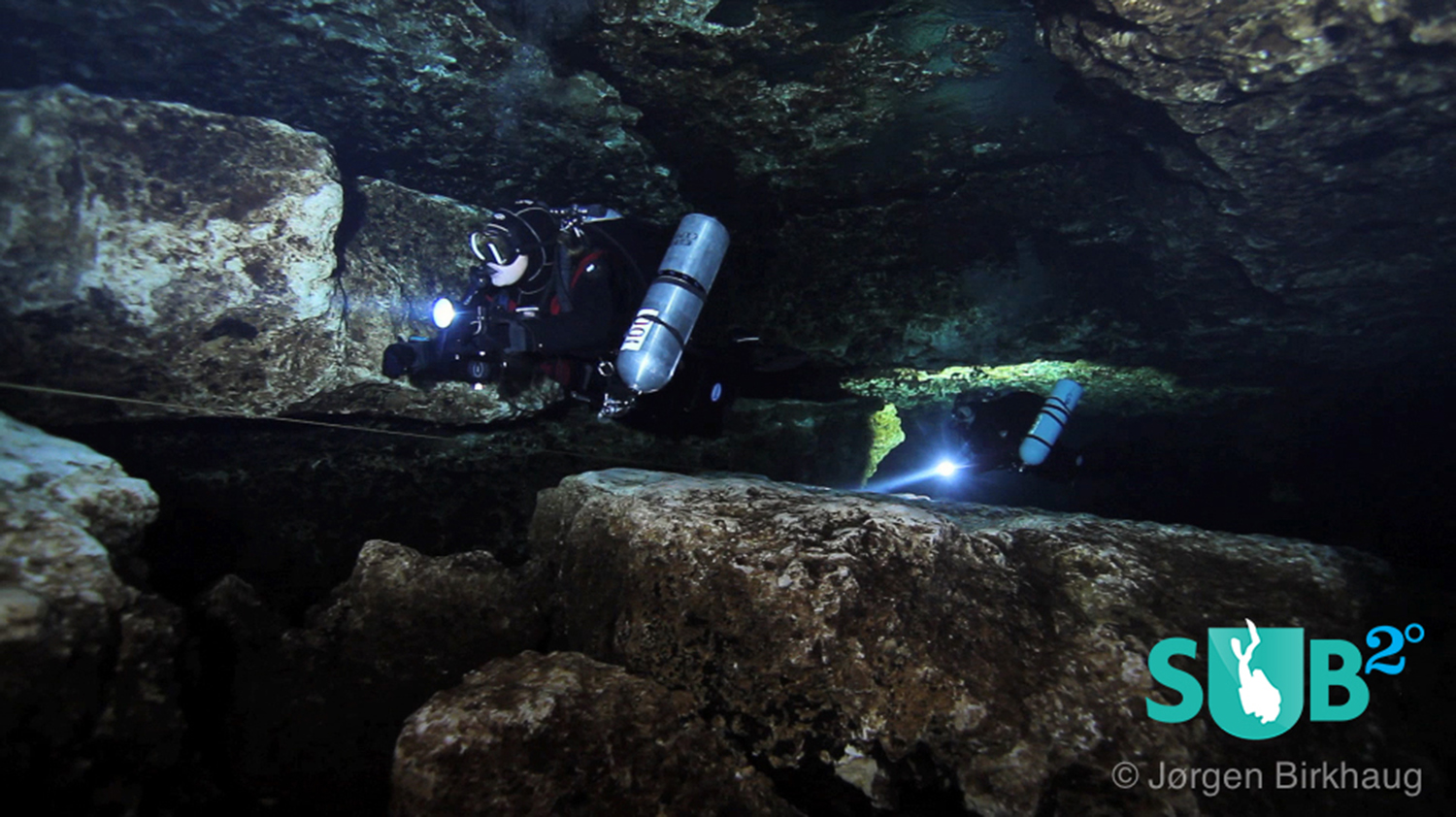 A team of cave divers approaching The Lips in Devil's Eye Cave.