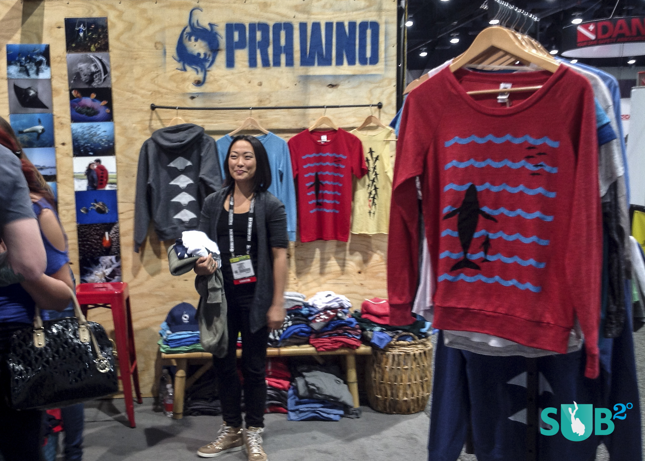 Lia Barrett, creative director for Prawno Apparel, shows off their fashionable ocean-minded clothing line.